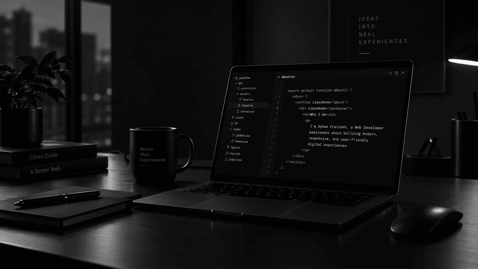 A developer workspace with a laptop displaying code